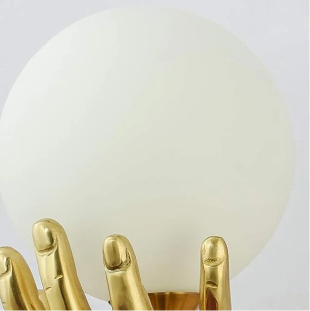 Creative Golden Resin Hand Holding Frosted Glass Globe Lamp - Image 5
