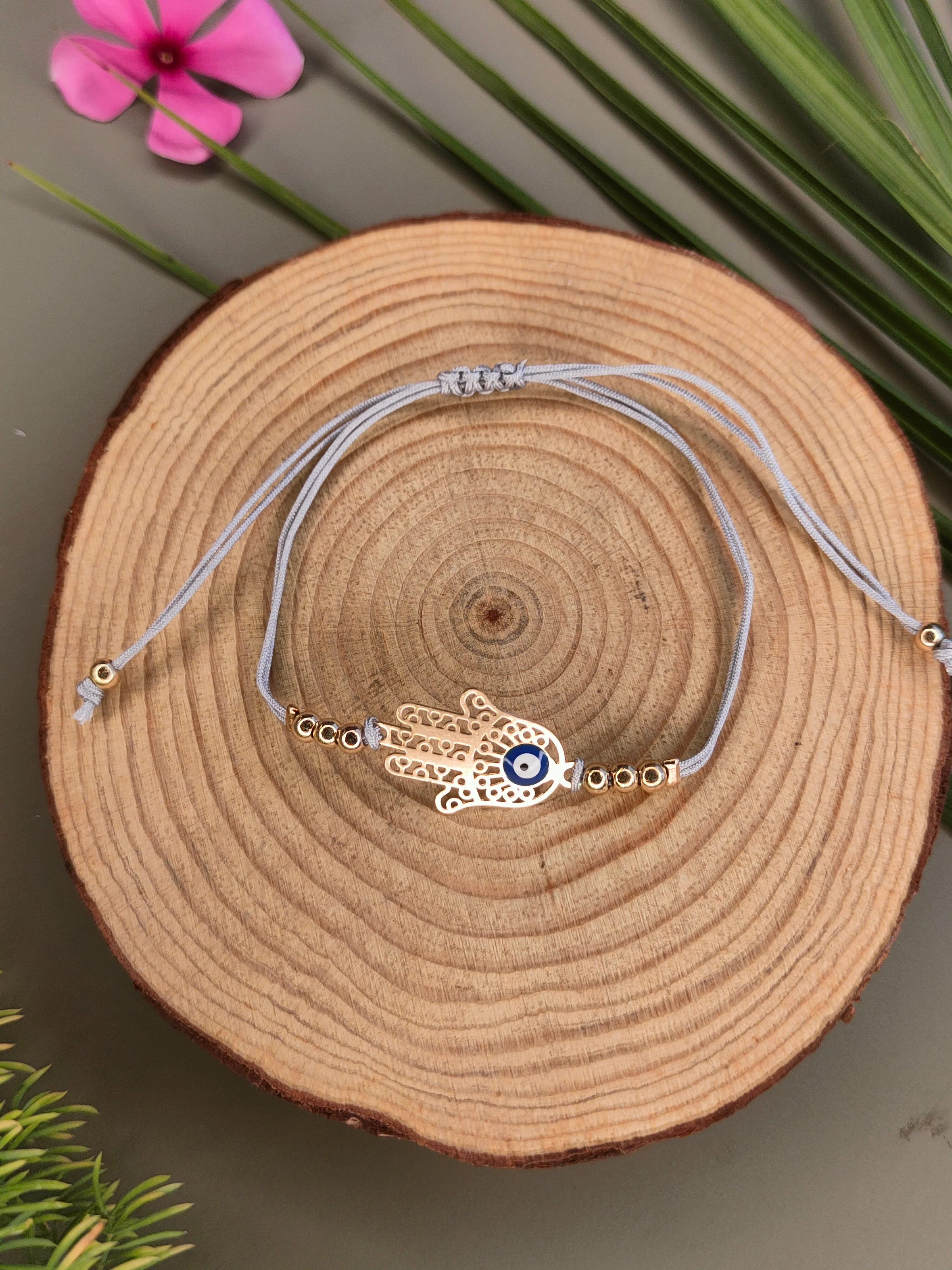 Evil Eye Woven Elegant Rakhi in Blessing Hands