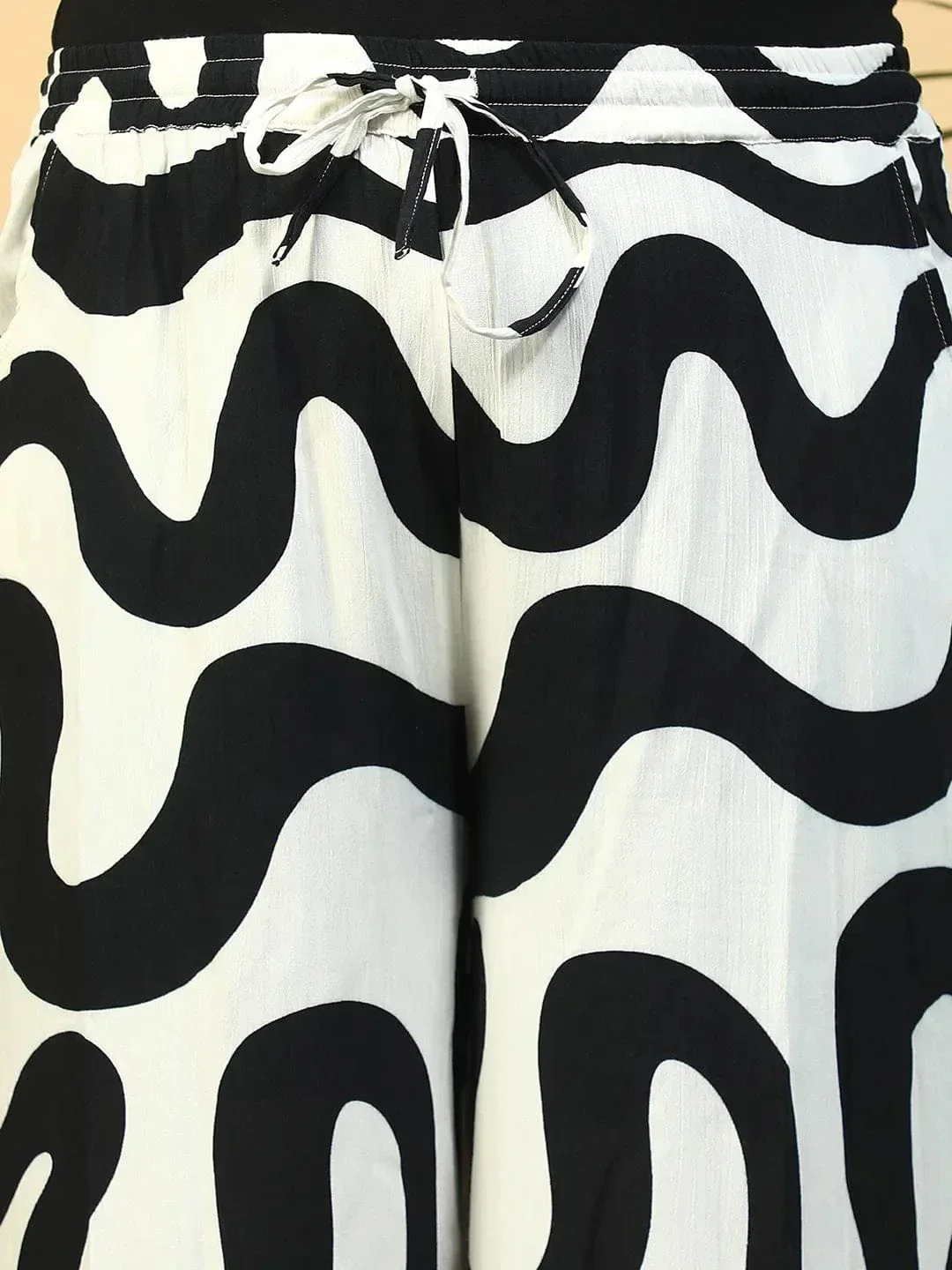 Off-White Flared Elasticated Waist, Tie-Up Detail & Side Pockets Plus Size Women Pant - Image 6